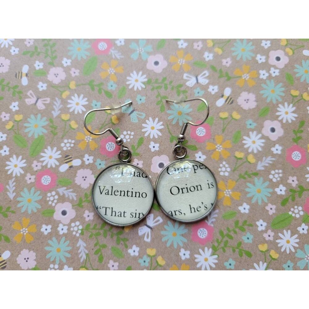 Valentino and Orion earrings made with First to Die at the End book pages